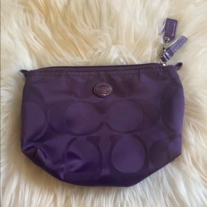 purple coach pouch